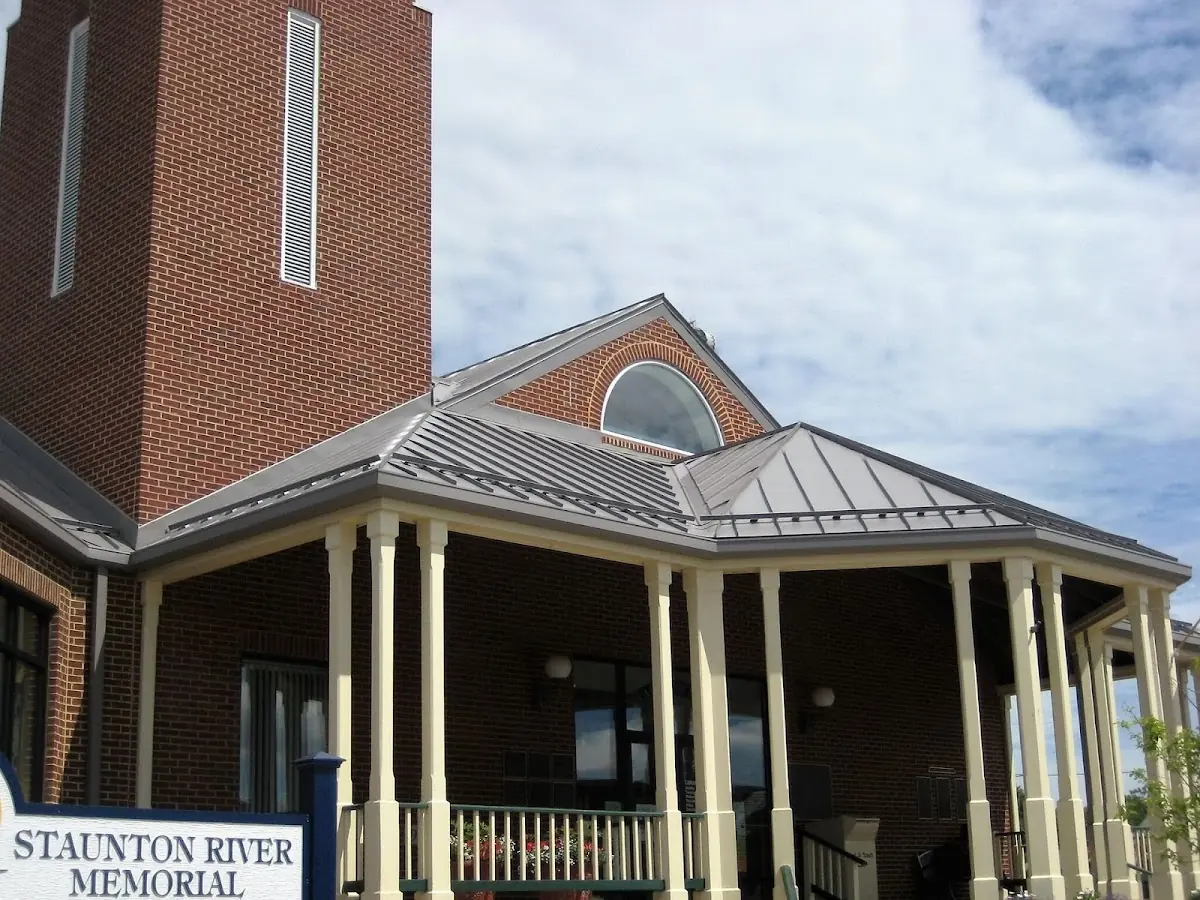 Skilled roofing craftsmen working on a residential roof in College Park